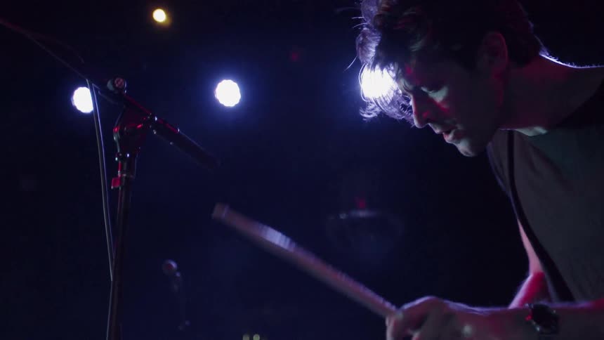 A drummer performs on stage