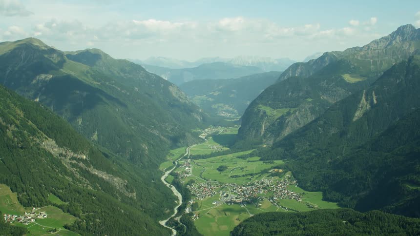 Land sits between the mountains on a sunny day
