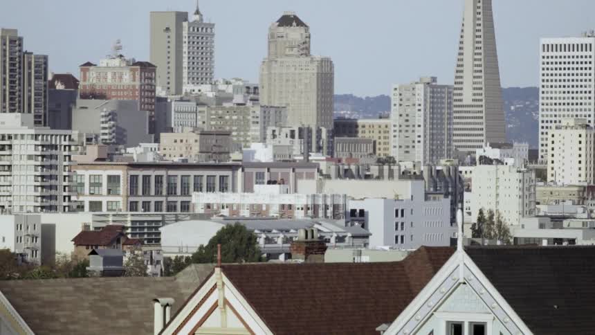 Buildings are shown in a city on a sunny day