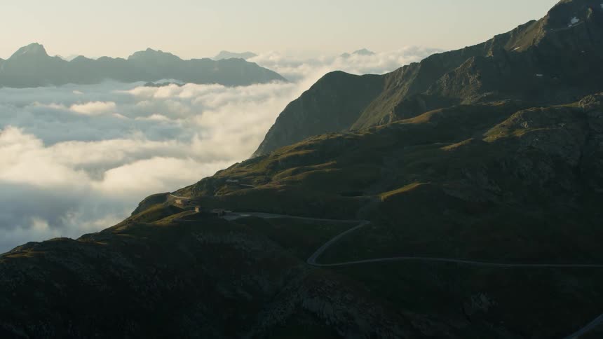 Mountain peak rises above the clouds