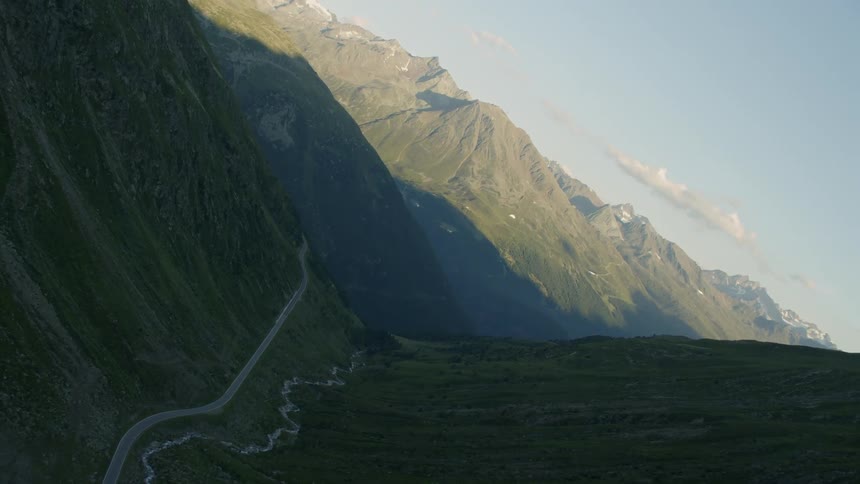Highway cuts through a mountain valley