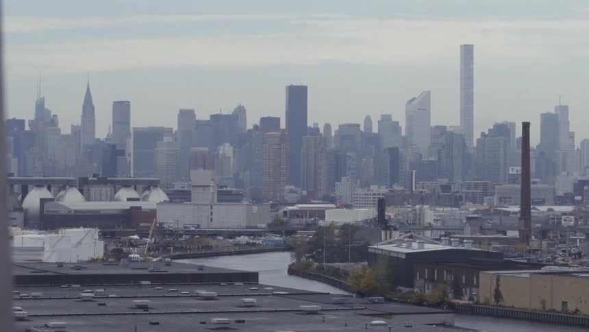Rooftops of a large city are being filmed