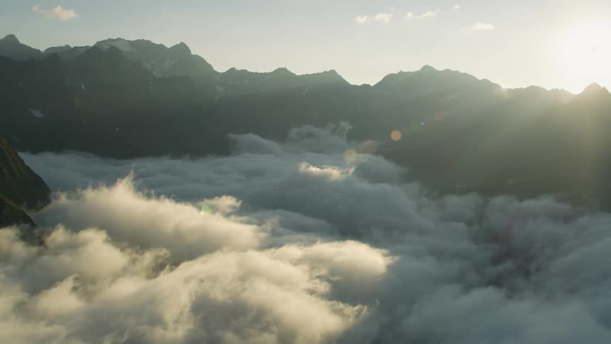 The mountain is covered with clouds below