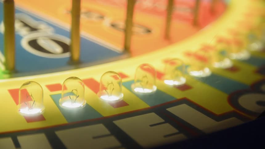 Lights flash on an arcade game