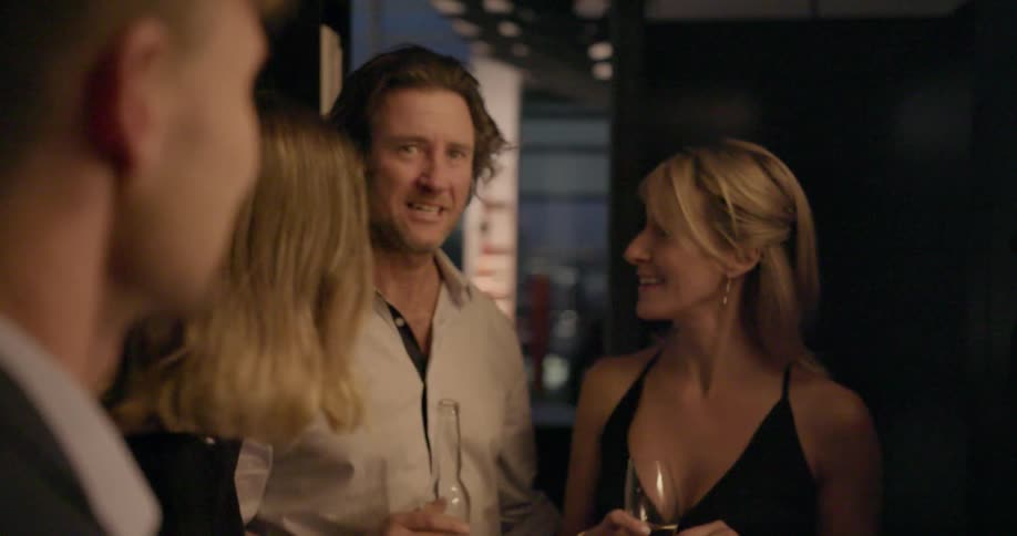 A group of people are drinking and chatting