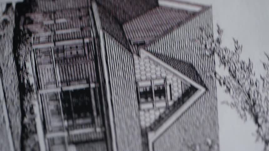 A house blueprint is displayed paper