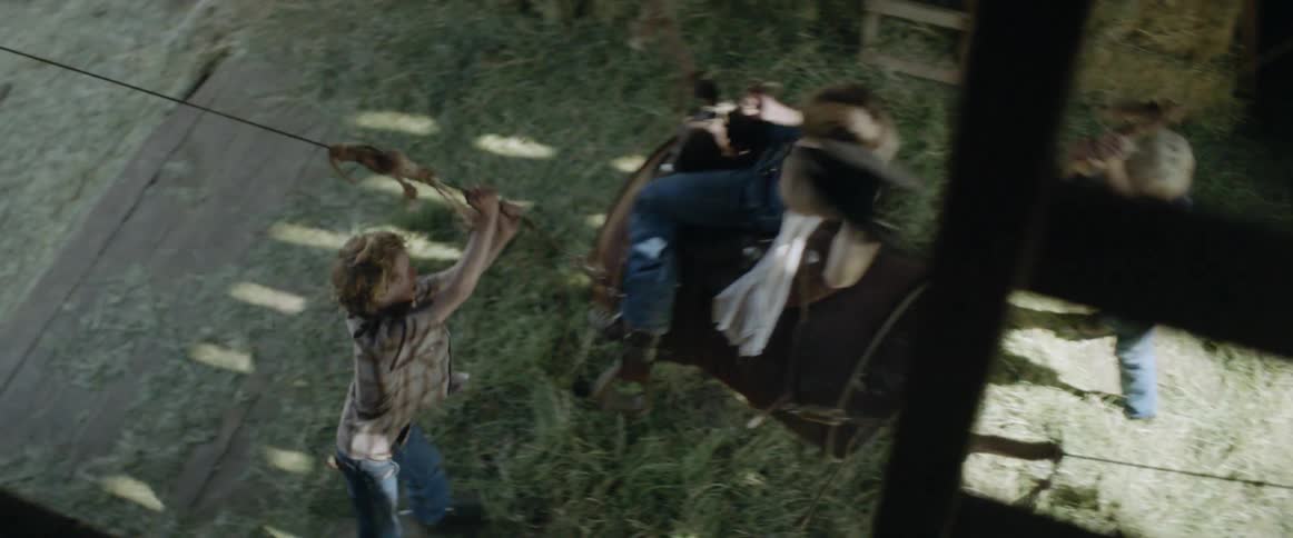 Young boy pretends to ride a bronco