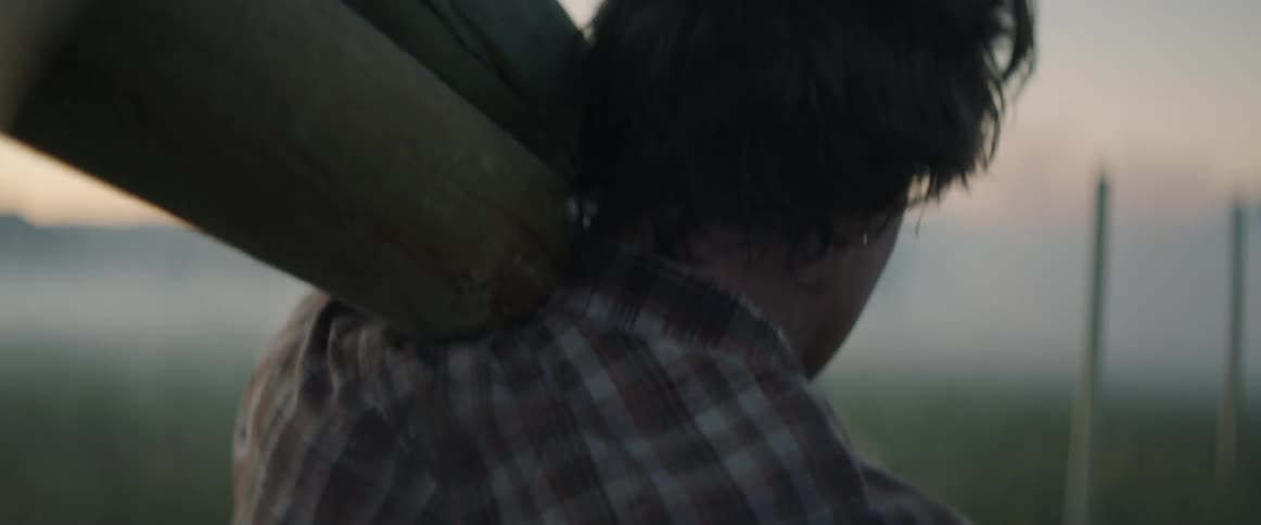 A man carries logs