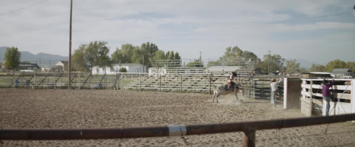 A man is whipped around on a bull before being thrown off