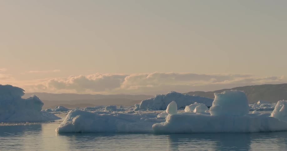 Icebergs are floating in the middle of the ocean