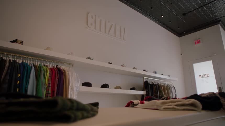 Clothes are displayed in a clothing store