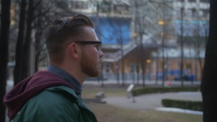 A man walks in an urban area