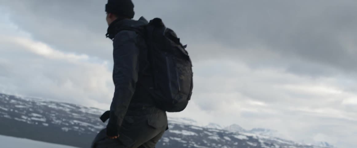 A hiker climbs up a hill