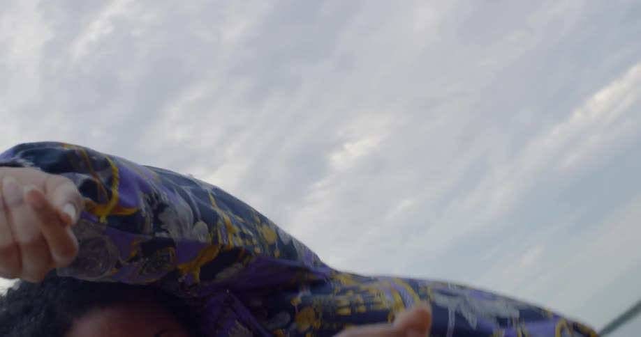 A woman is dancing on a cloudy day