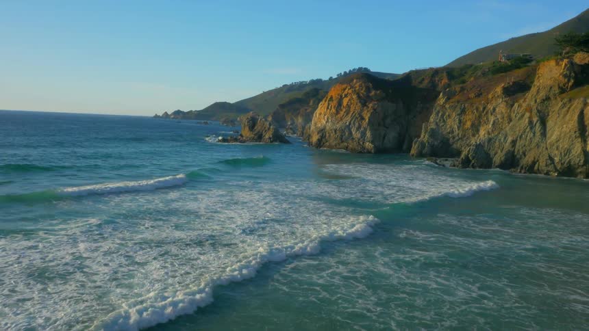 Waves flow onto the beach shore