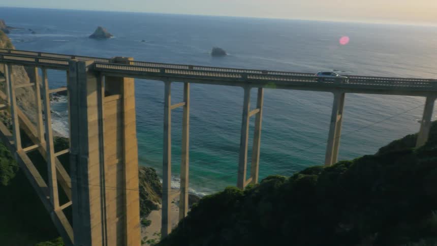 The bridge has cars traveling in both directions