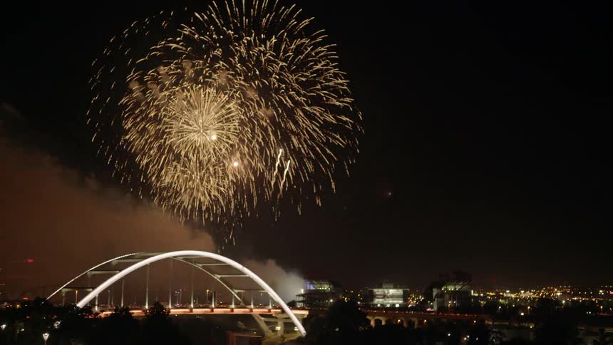 Fireworks Explode Over A City Harbor