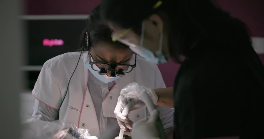 Dentist works on a patient's teeth
