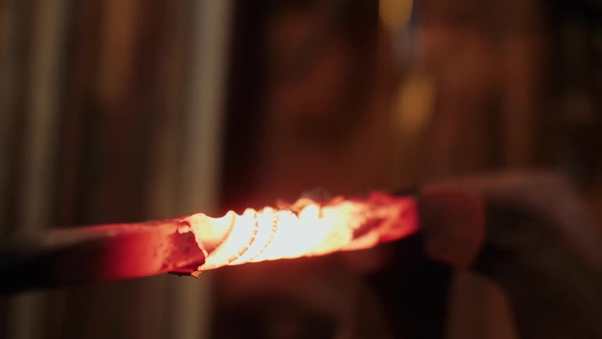 A piece of hot metal glows red