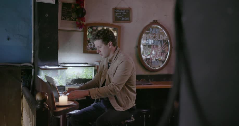 A man is typing on his keyboard