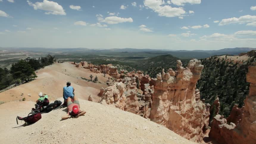 Hikers rest atop a canyon rim
