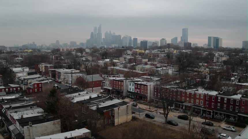 Past the homes in this town are very tall buildings