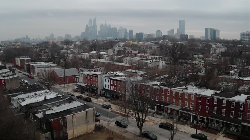 City buildings cover the ground on a hazy day