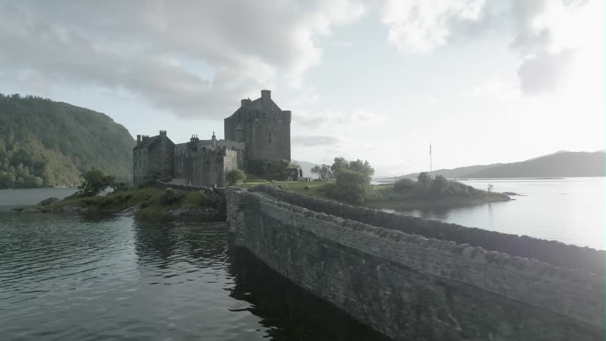 An old stone building sits on a lake island