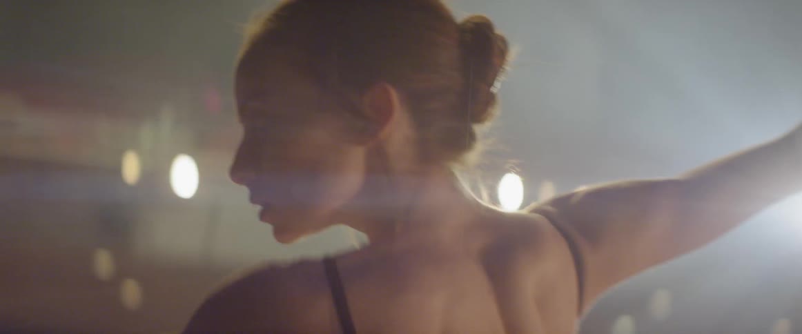 A ballerina dances on stage