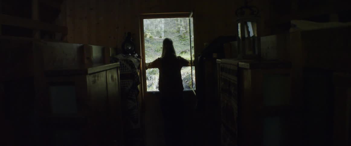 Someone is opening the window in a wooden house