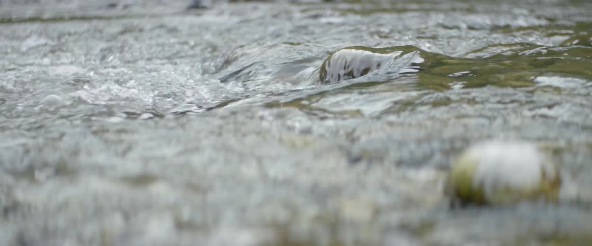 River water flows over rocks