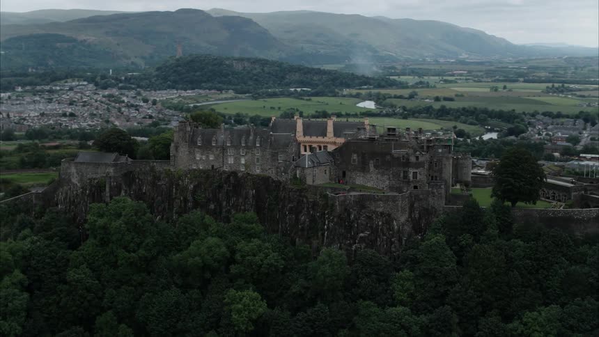 A large castle sits on top of a hill