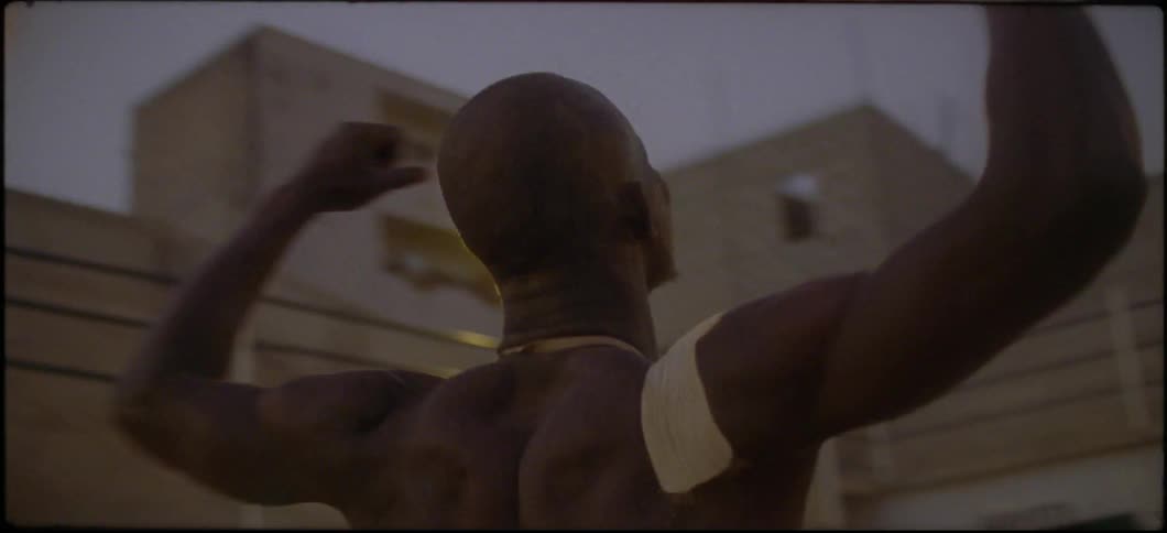A man celebrates inside an arena