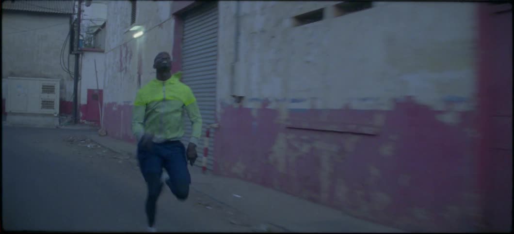 A man sprints down a street
