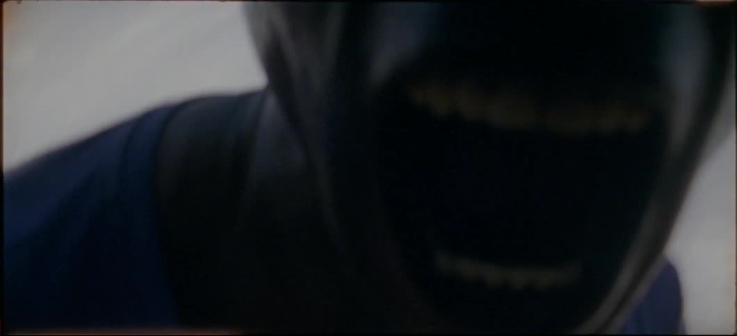 A man leans forward screaming