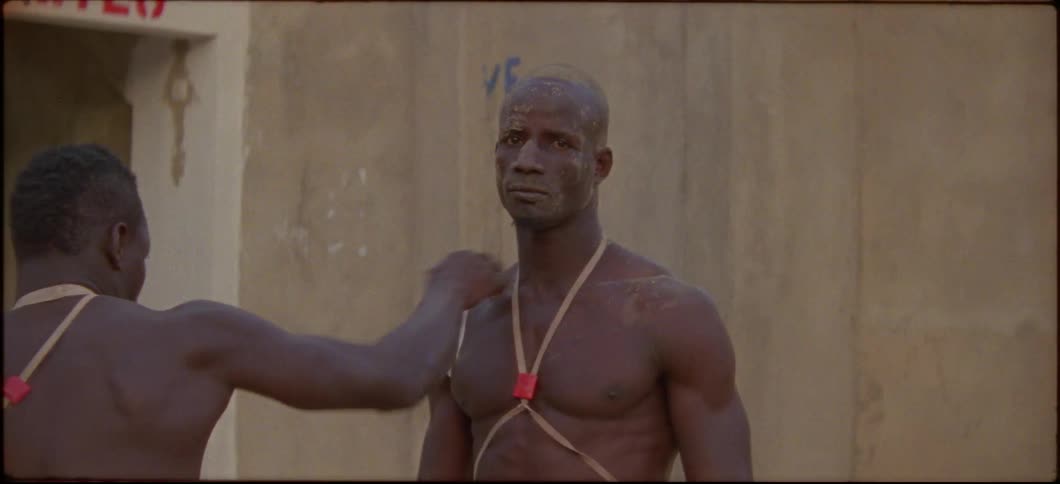 A man throws fake jabs at a standing man