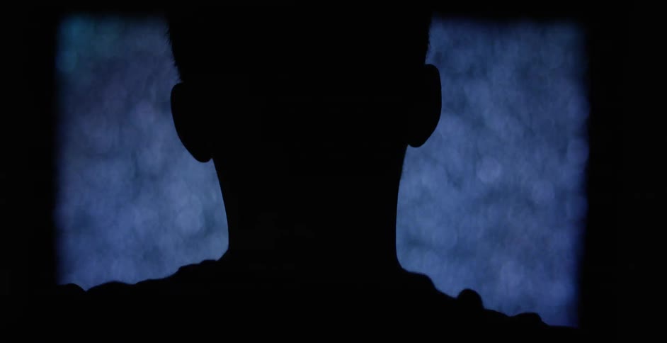 Man standing in front of a screen with static
