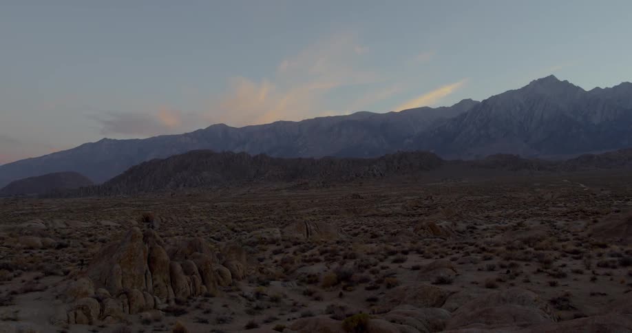 A lunar mountainscape at sunset