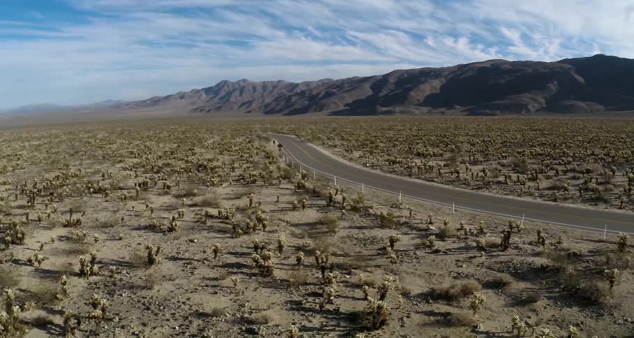A road winds through the desert