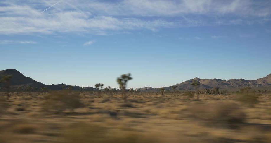 View of a large field with mountains in the distance