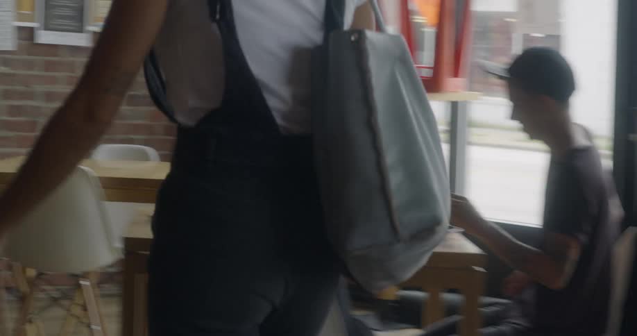 A woman enters a business