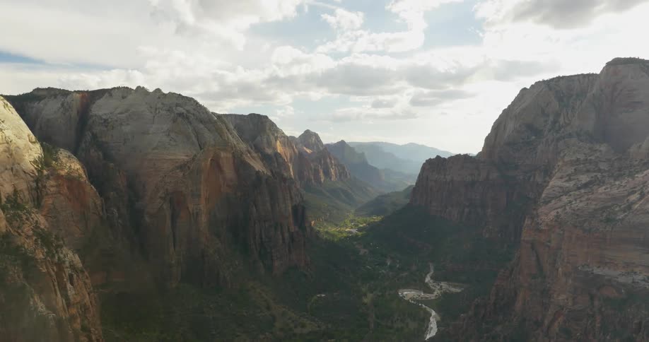 Large mountains on two sides of a forest
