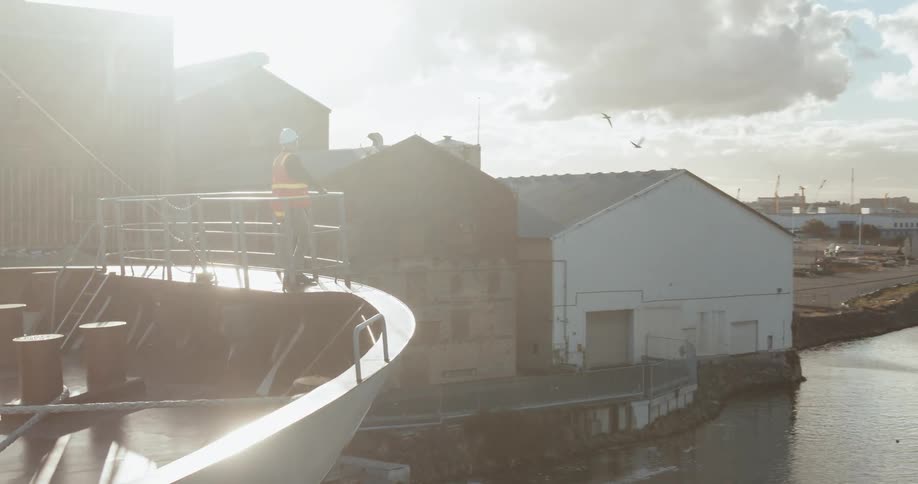 A man stands on the edge of a boat