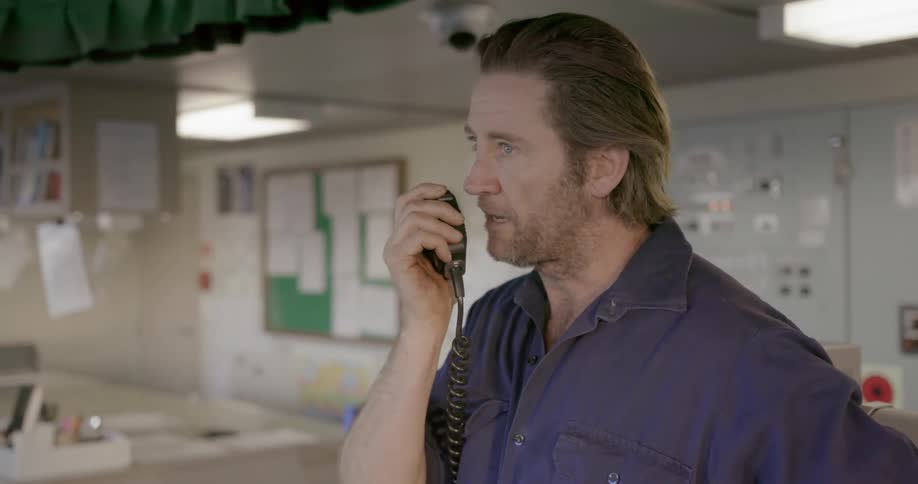 Man speaks into a walkie talkie