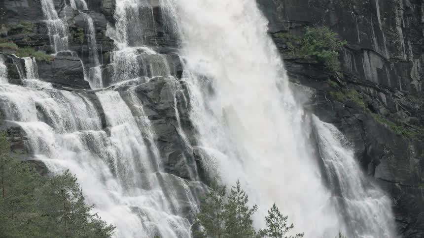 A waterfall cascades over a rocky cliffside