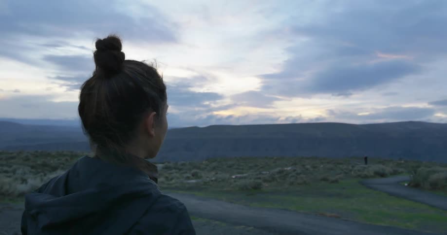 A woman with her hair in a bun