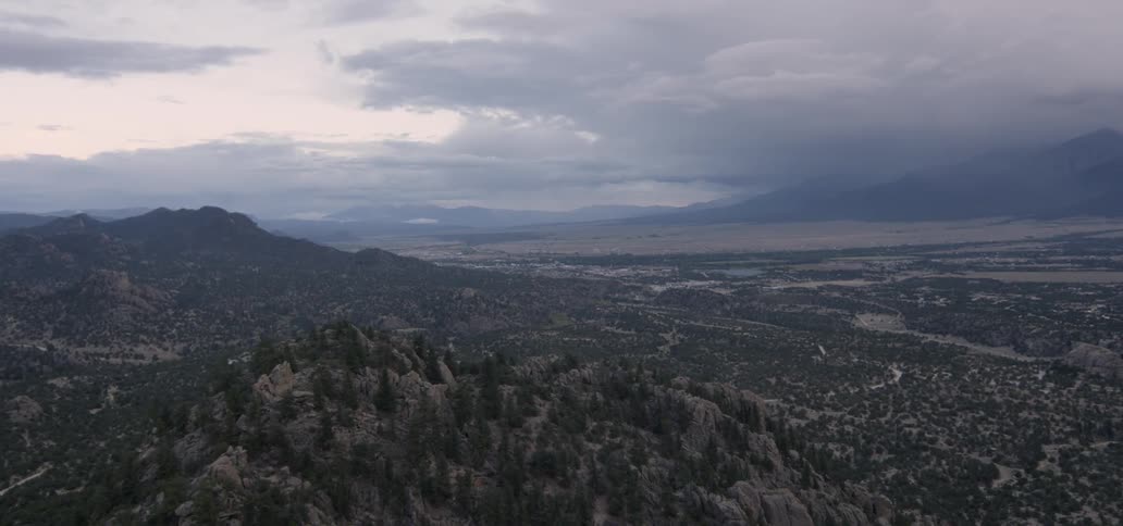Clouds float over a mountain valley