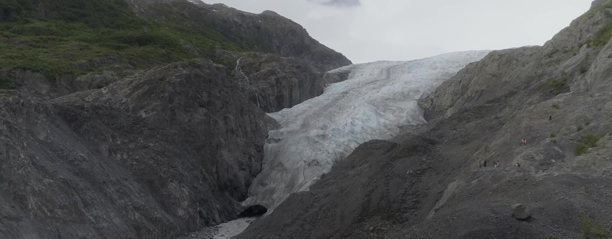 Dirty snow rests on a mountainside