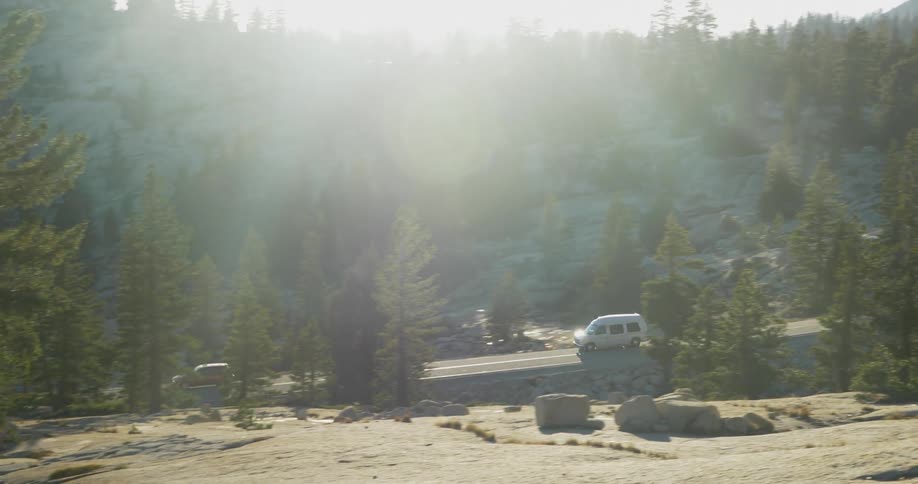 View of cars traveling on a road from a cliff