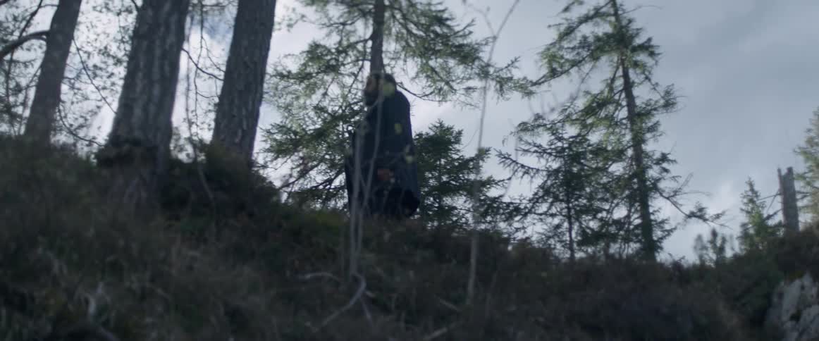 A man is walking on a ridge